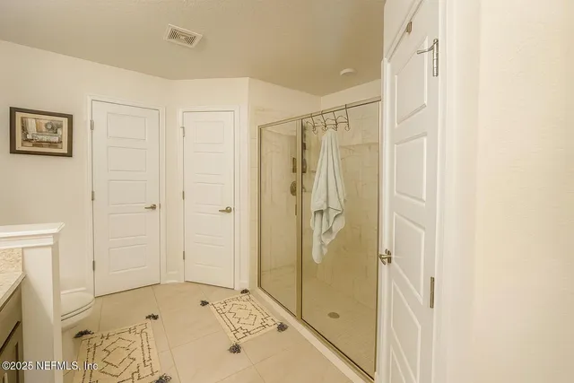 a bathroom with a shower and a tub