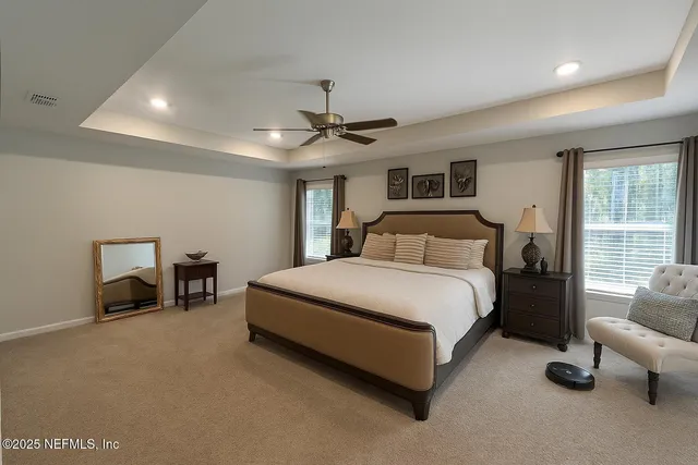 a bedroom with a bed and a couch