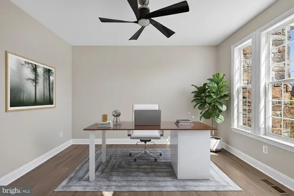 a kitchen with stainless steel appliances granite countertop a sink a stove and a wooden floors
