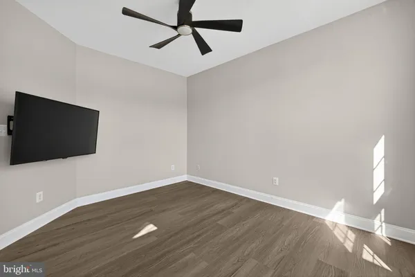 a kitchen with stainless steel appliances granite countertop a refrigerator a sink and a stove