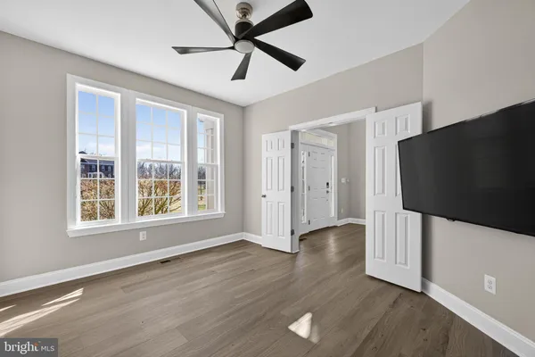a kitchen with granite countertop stainless steel appliances and wooden cabinets