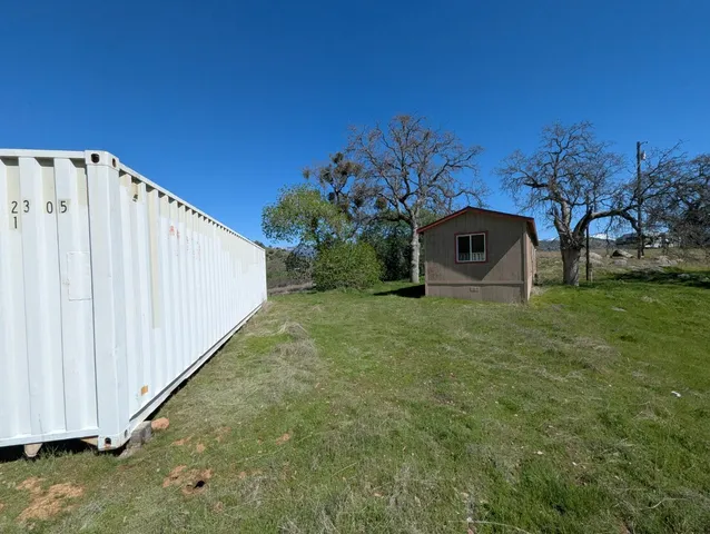 a view of a back yard of the house