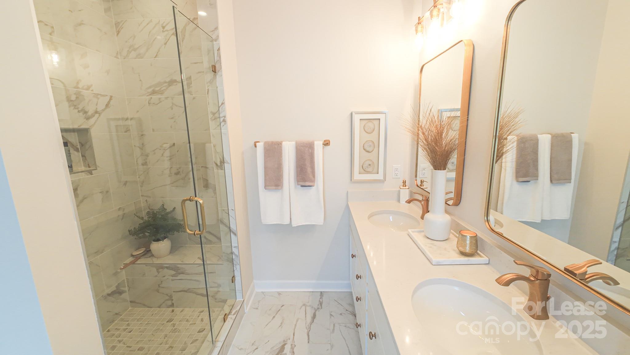 1018 Stone Marker Drive Monroe, NC 28112 - Photo 12 of 24 a spacious bathroom with sink shower and mirror