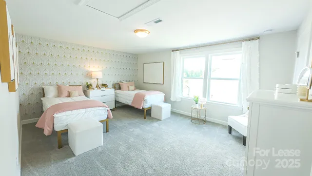 a bedroom with bed and a window