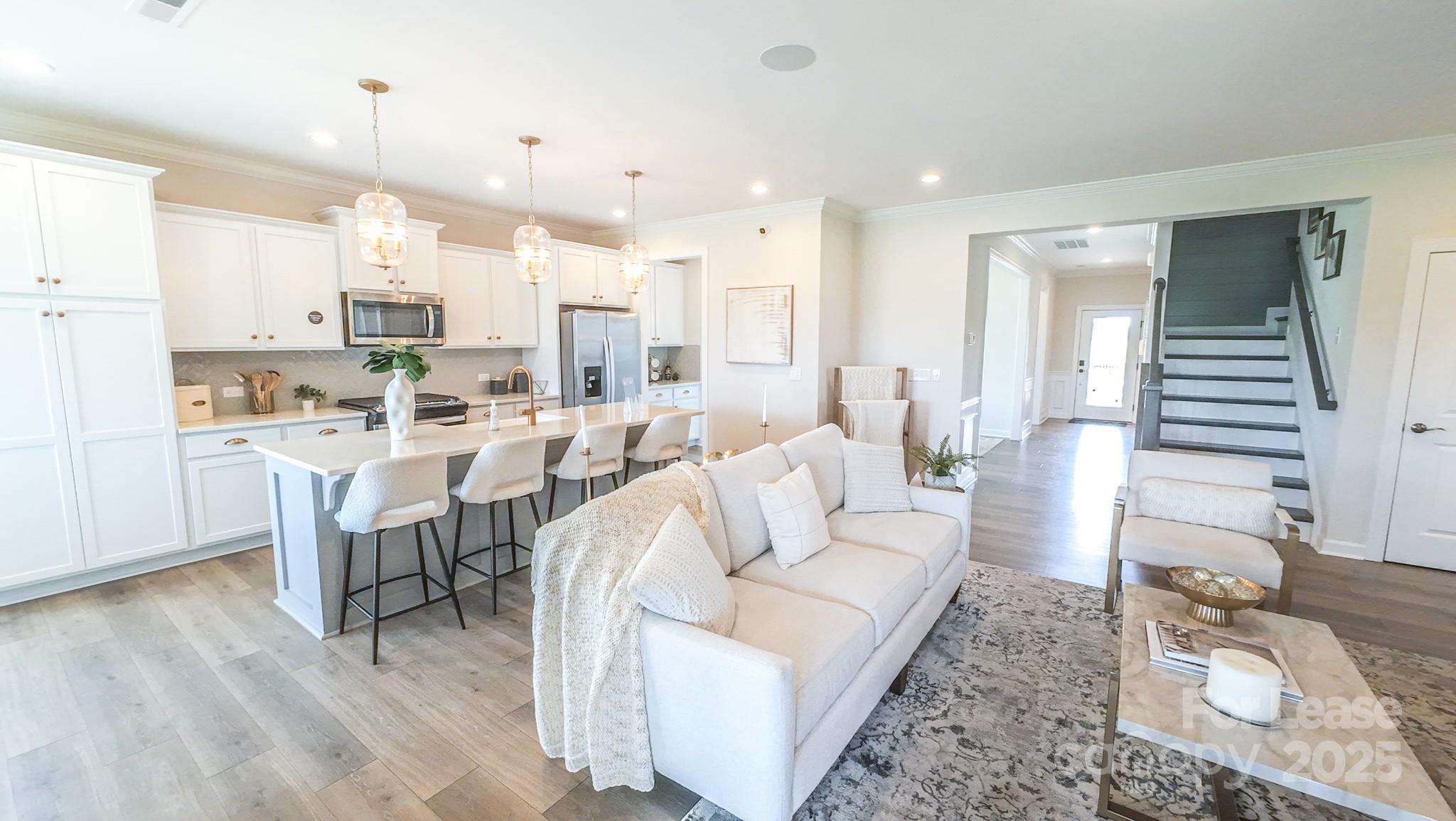 1018 Stone Marker Drive Monroe, NC 28112 - Photo 2 of 24 a living room with lots of furniture and a wooden floor