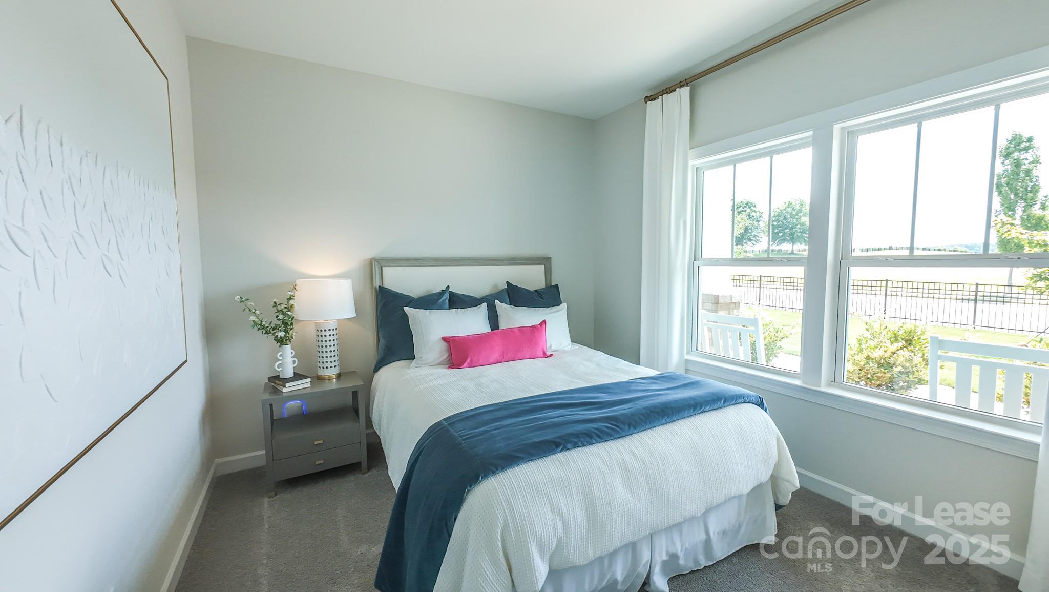 1018 Stone Marker Drive Monroe, NC 28112 - Photo 4 of 24 a bedroom with a bed and a window