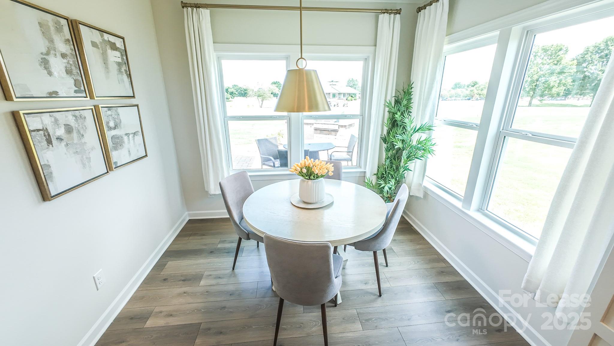 1018 Stone Marker Drive Monroe, NC 28112 - Photo 6 of 24 a dining room with furniture and window