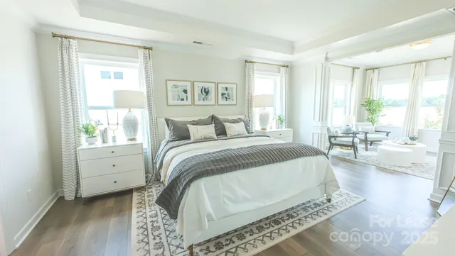 a spacious bedroom with a large bed and a window