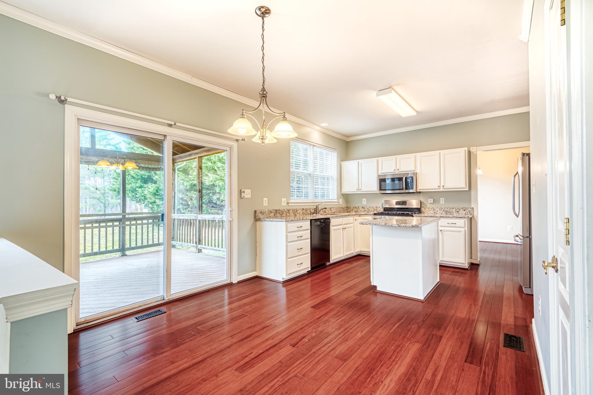 5874 Montgomery Road Elkridge, MD 21075 - Photo 8 of 31 Access screened in porch from kitchen