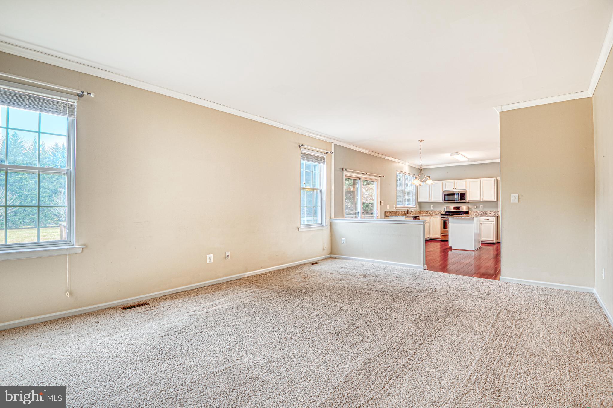 5874 Montgomery Road Elkridge, MD 21075 - Photo 9 of 31 Living room opens up to kitchen