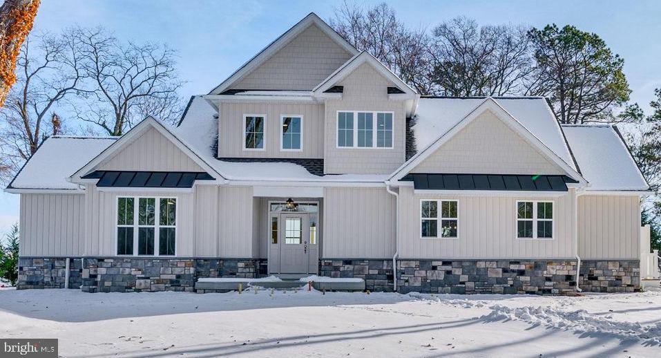 a front view of a house with trees