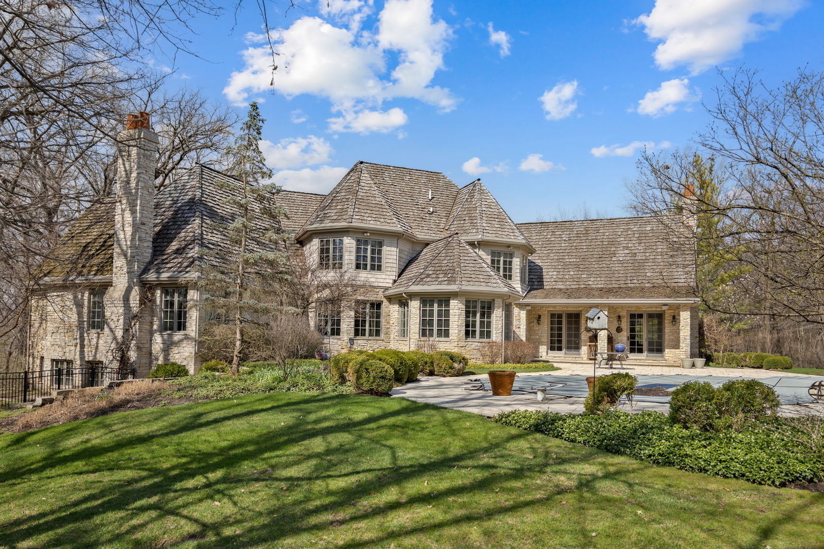 33W551 Hub Road Wayne, IL 60184 - Photo 54 of 59 a front view of a building with a garden and trees