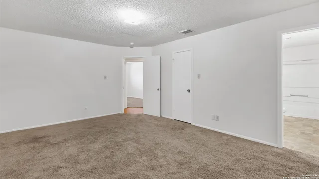 an empty room with an entryway