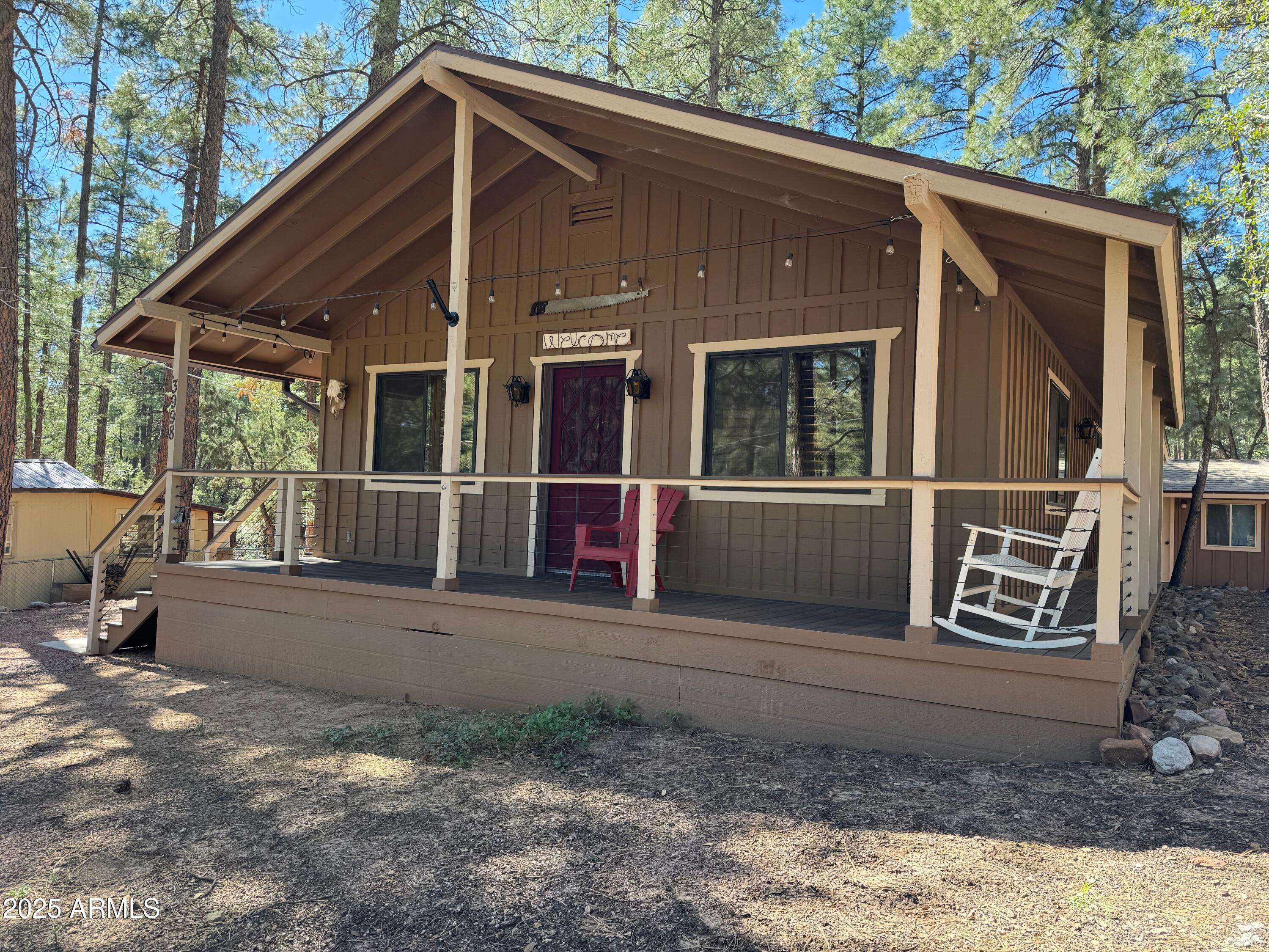 3998 Bloody Basin Road Pine, AZ 85544 - Photo 18 of 71 a backyard of a house with wooden floor and outdoor space