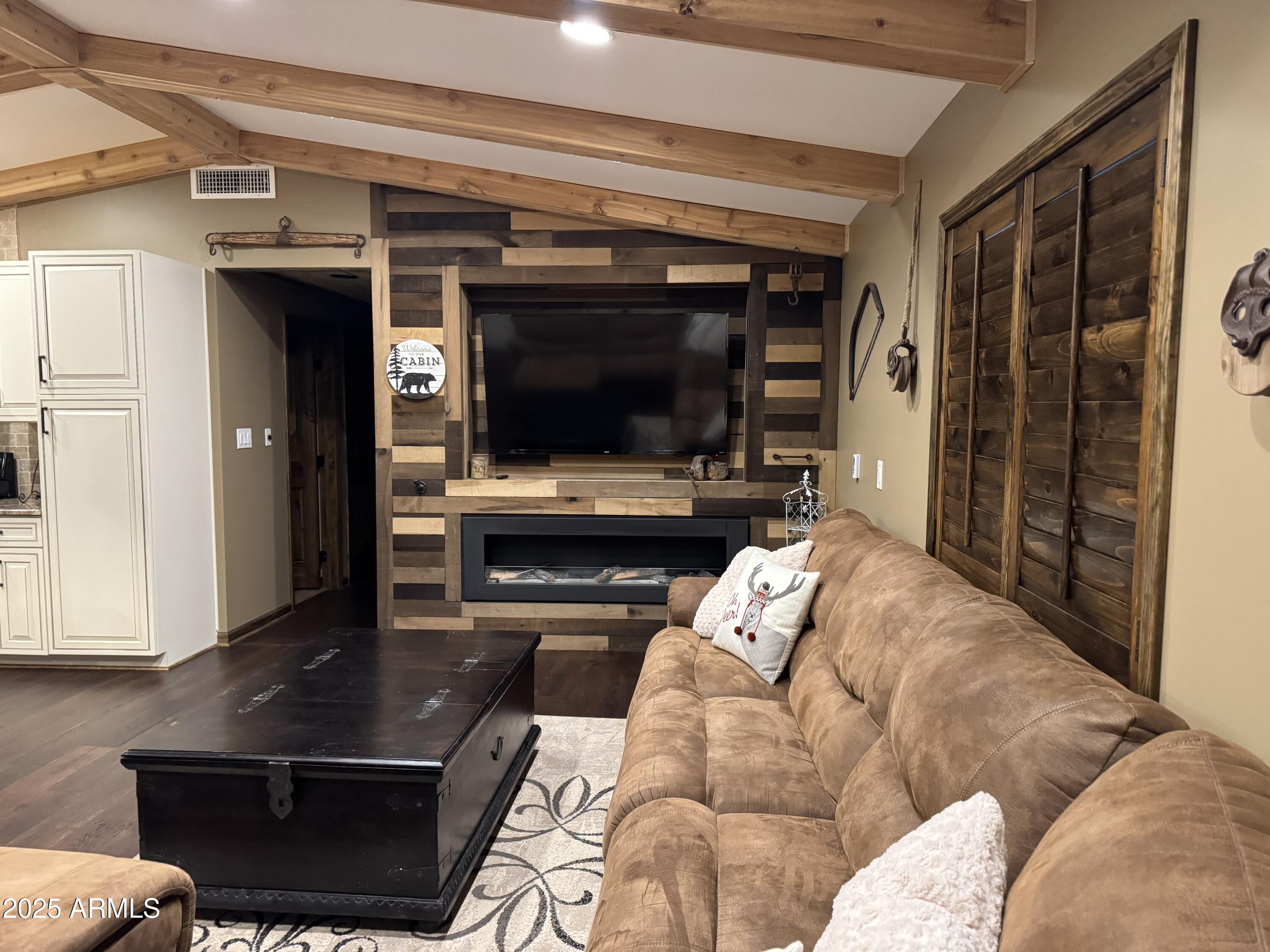 3998 Bloody Basin Road Pine, AZ 85544 - Photo 4 of 71 a living room with furniture and a flat screen tv