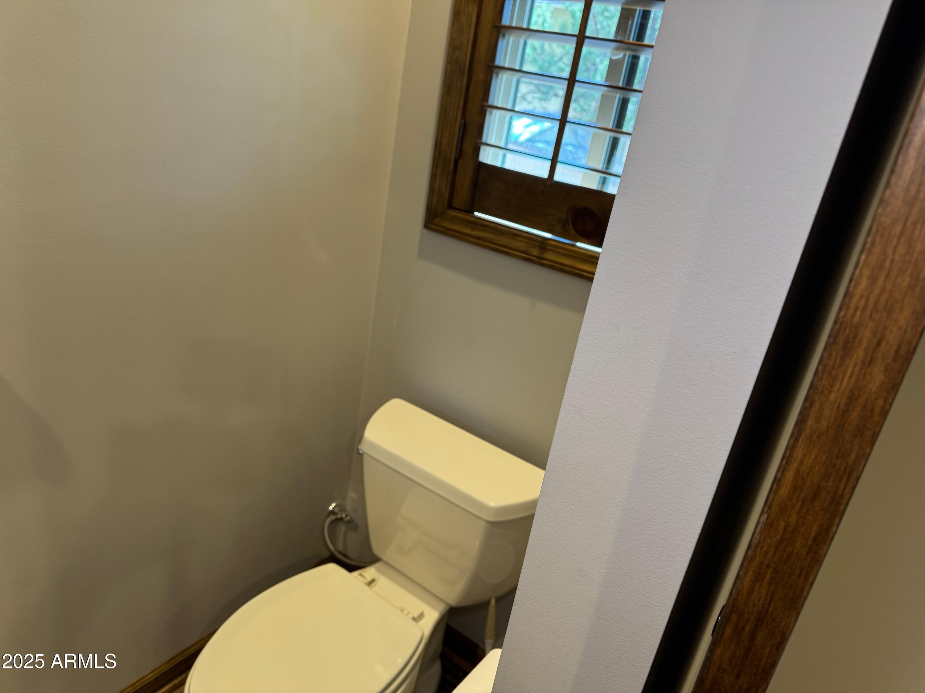 3998 Bloody Basin Road Pine, AZ 85544 - Photo 43 of 71 a white toilet sitting next to a sink