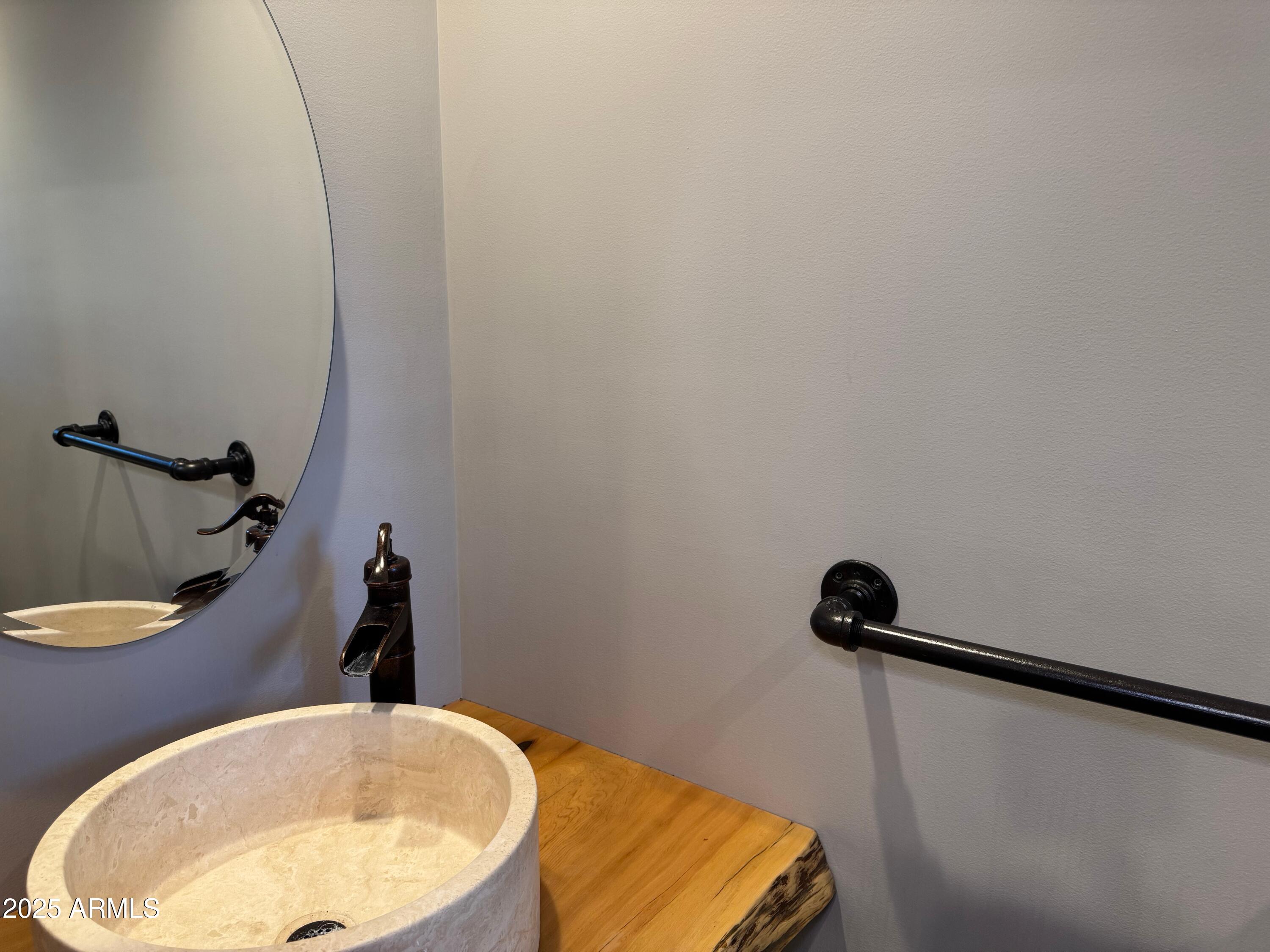 3998 Bloody Basin Road Pine, AZ 85544 - Photo 45 of 71 a bathroom with a sink and mirror