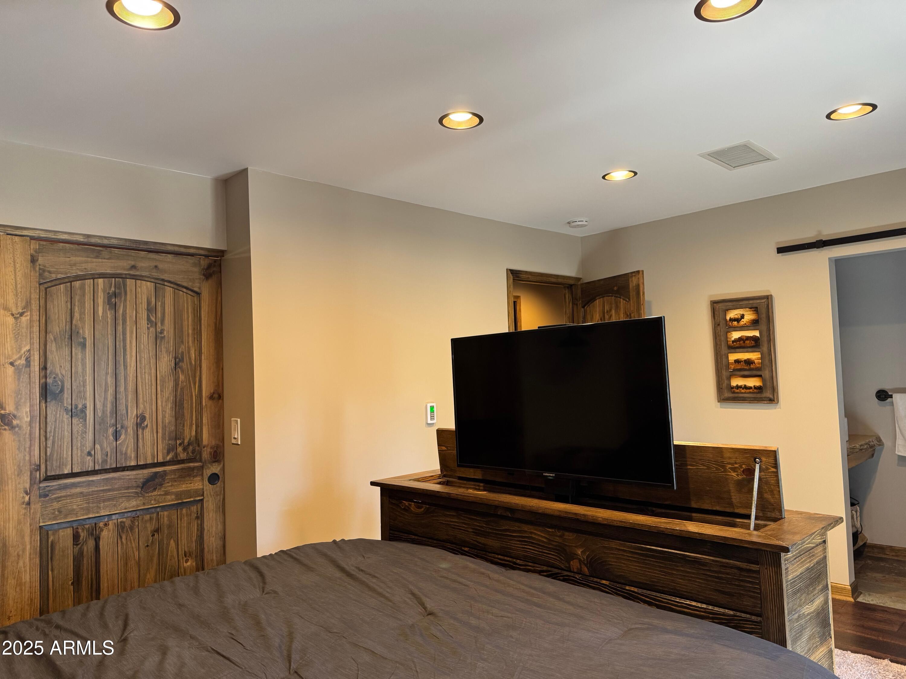3998 Bloody Basin Road Pine, AZ 85544 - Photo 50 of 71 a living room with a flat screen tv and a refrigerator