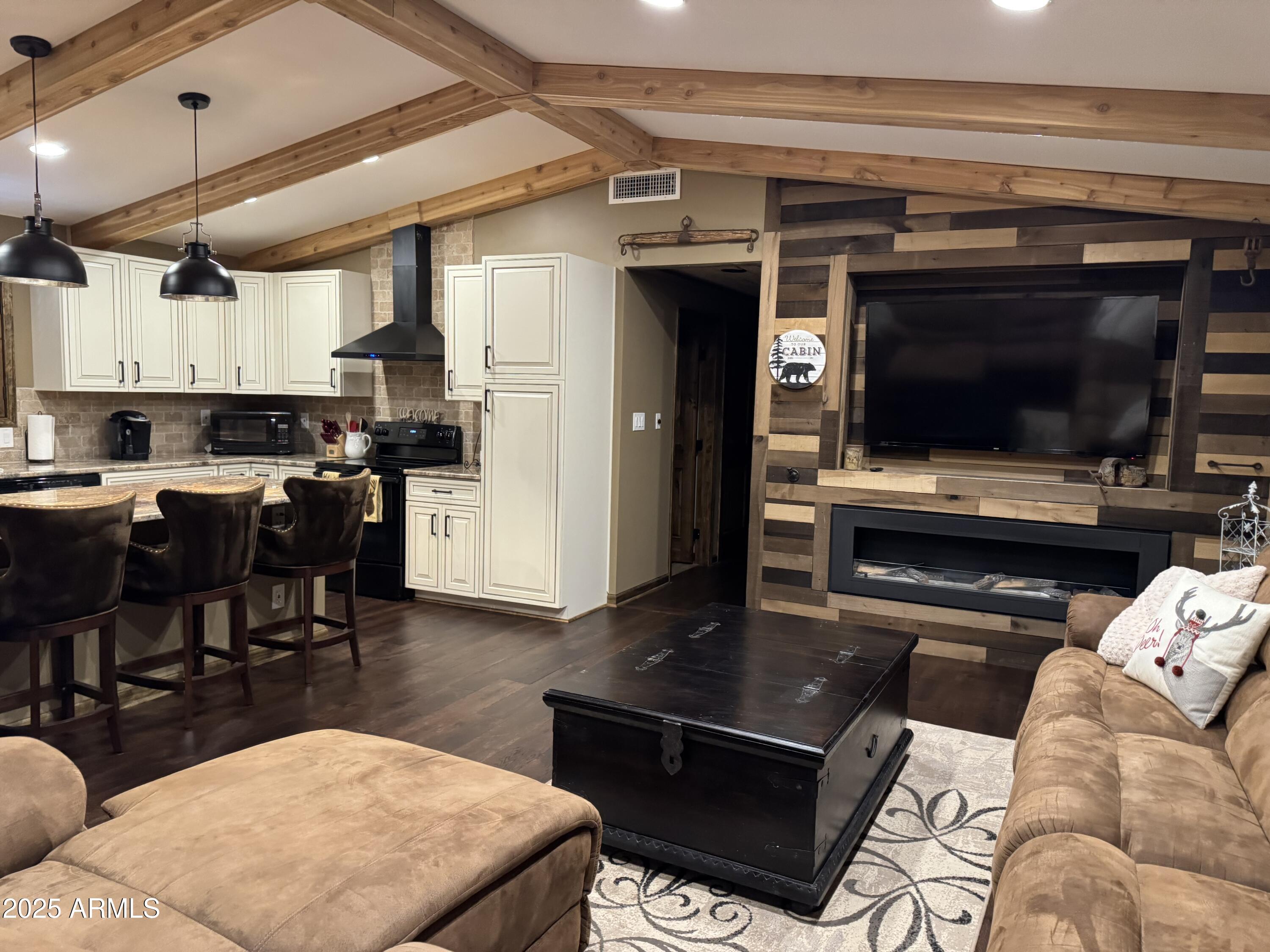 3998 Bloody Basin Road Pine, AZ 85544 - Photo 5 of 71 a living room with stainless steel appliances furniture and a kitchen view
