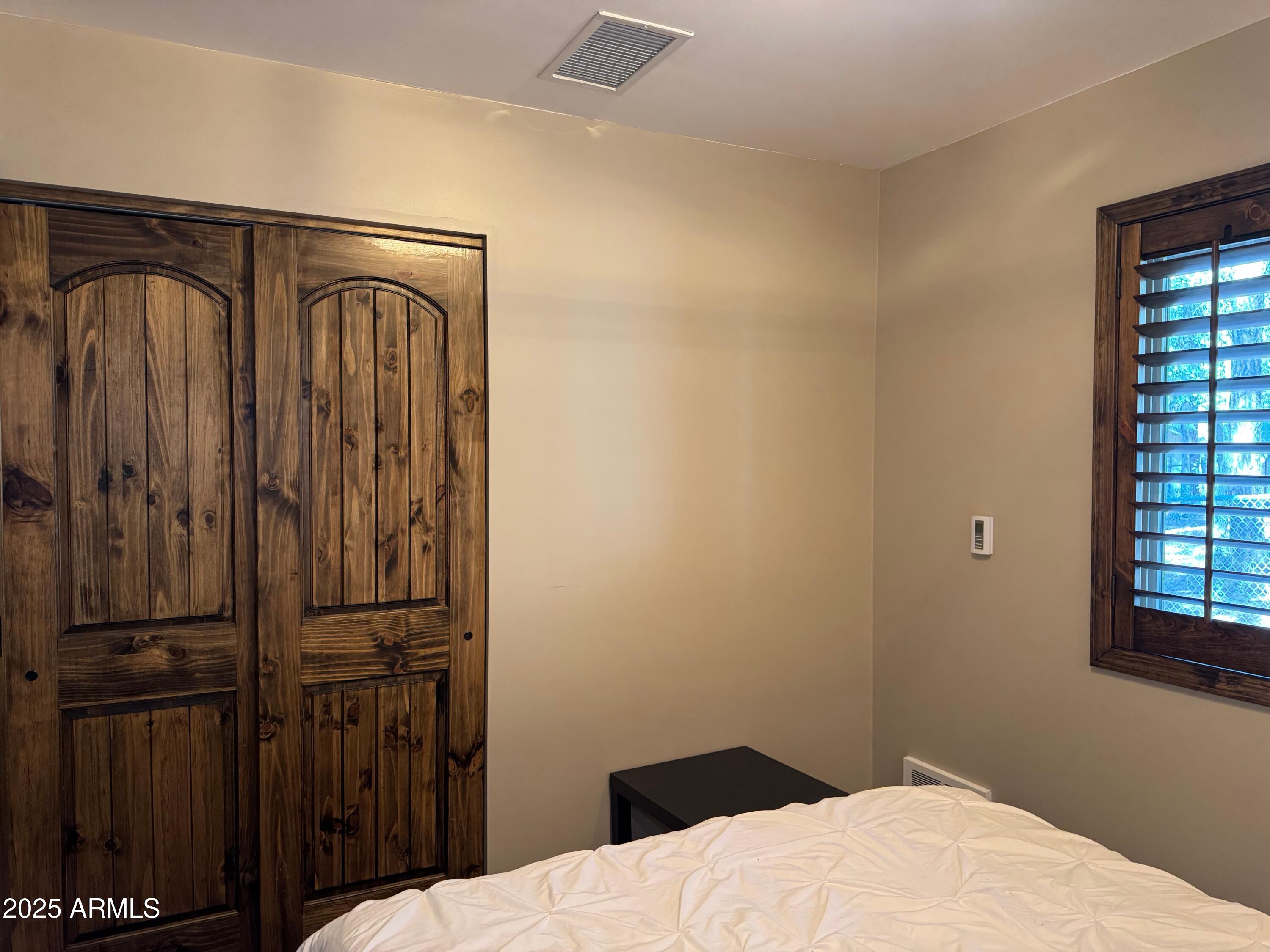 3998 Bloody Basin Road Pine, AZ 85544 - Photo 55 of 71 a bedroom with a bed and a window