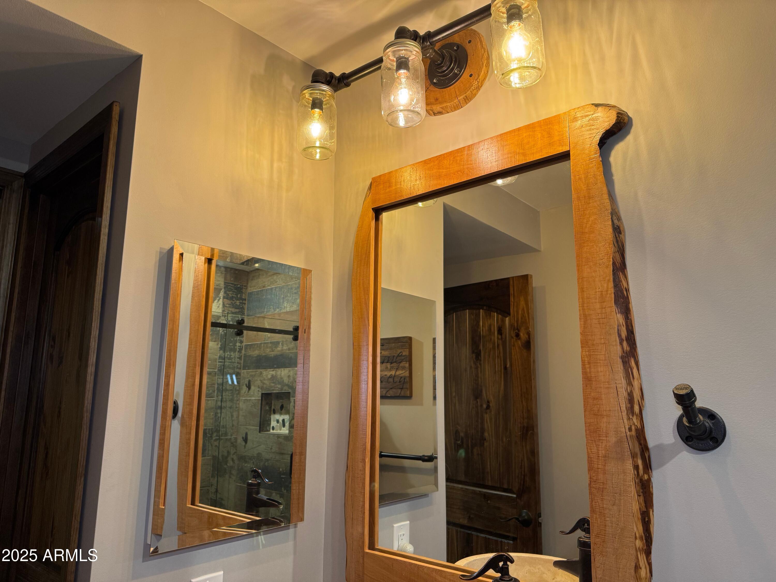 3998 Bloody Basin Road Pine, AZ 85544 - Photo 62 of 71 a bathroom with a shower and a mirror