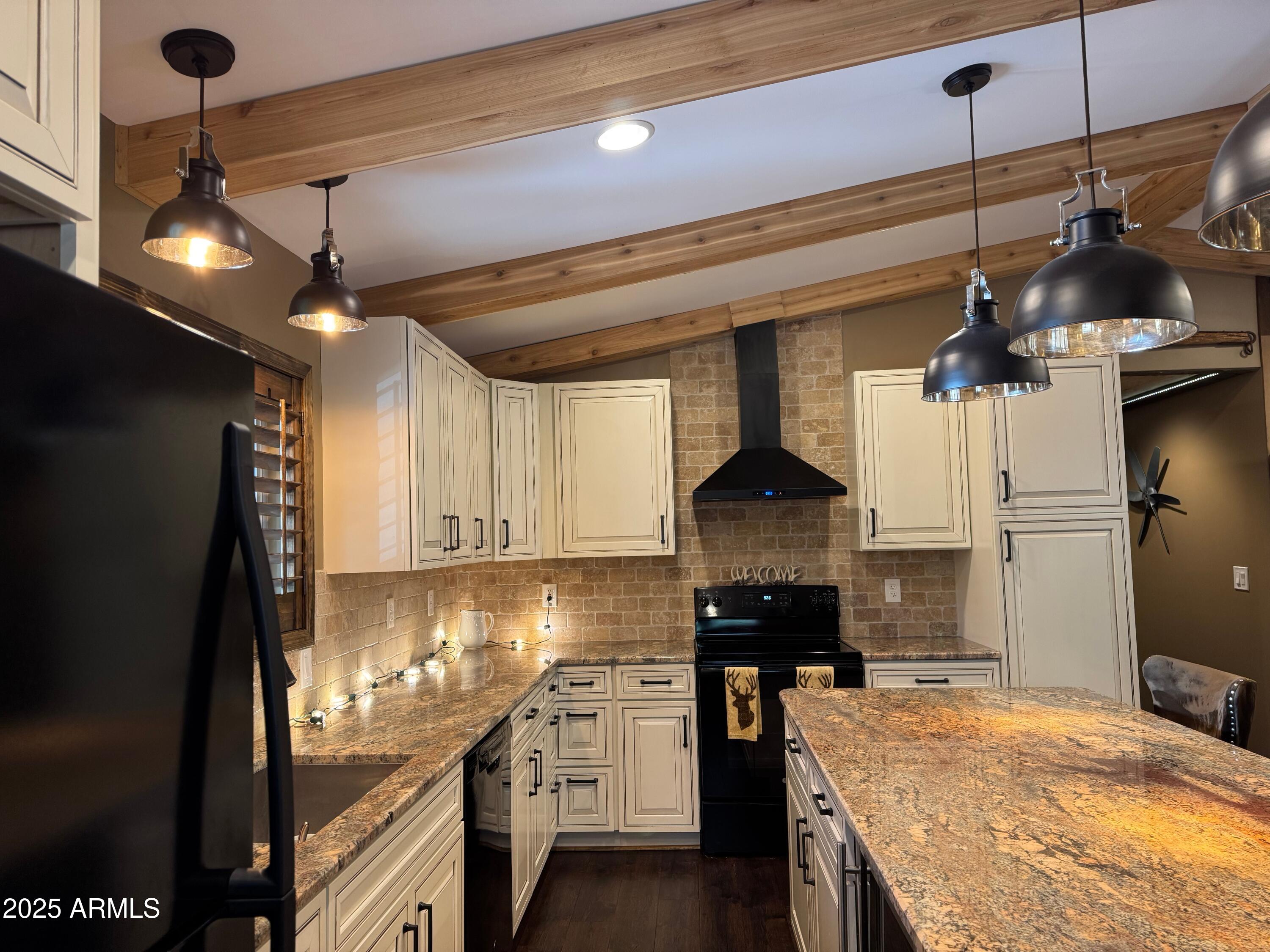 3998 Bloody Basin Road Pine, AZ 85544 - Photo 69 of 71 a kitchen with a stove and a chandelier