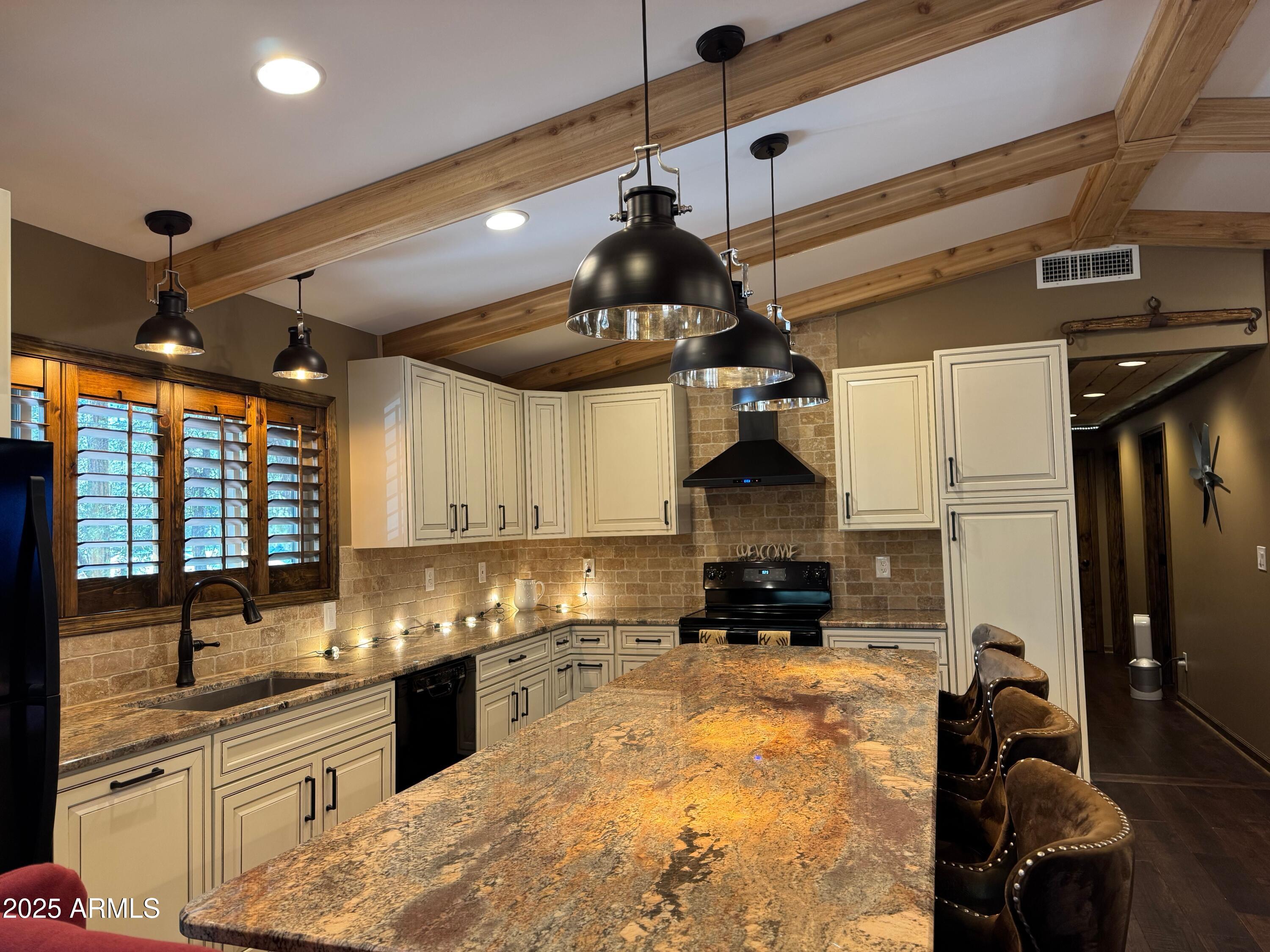 3998 Bloody Basin Road Pine, AZ 85544 - Photo 70 of 71 a kitchen with stainless steel appliances granite countertop a sink a stove and cabinets