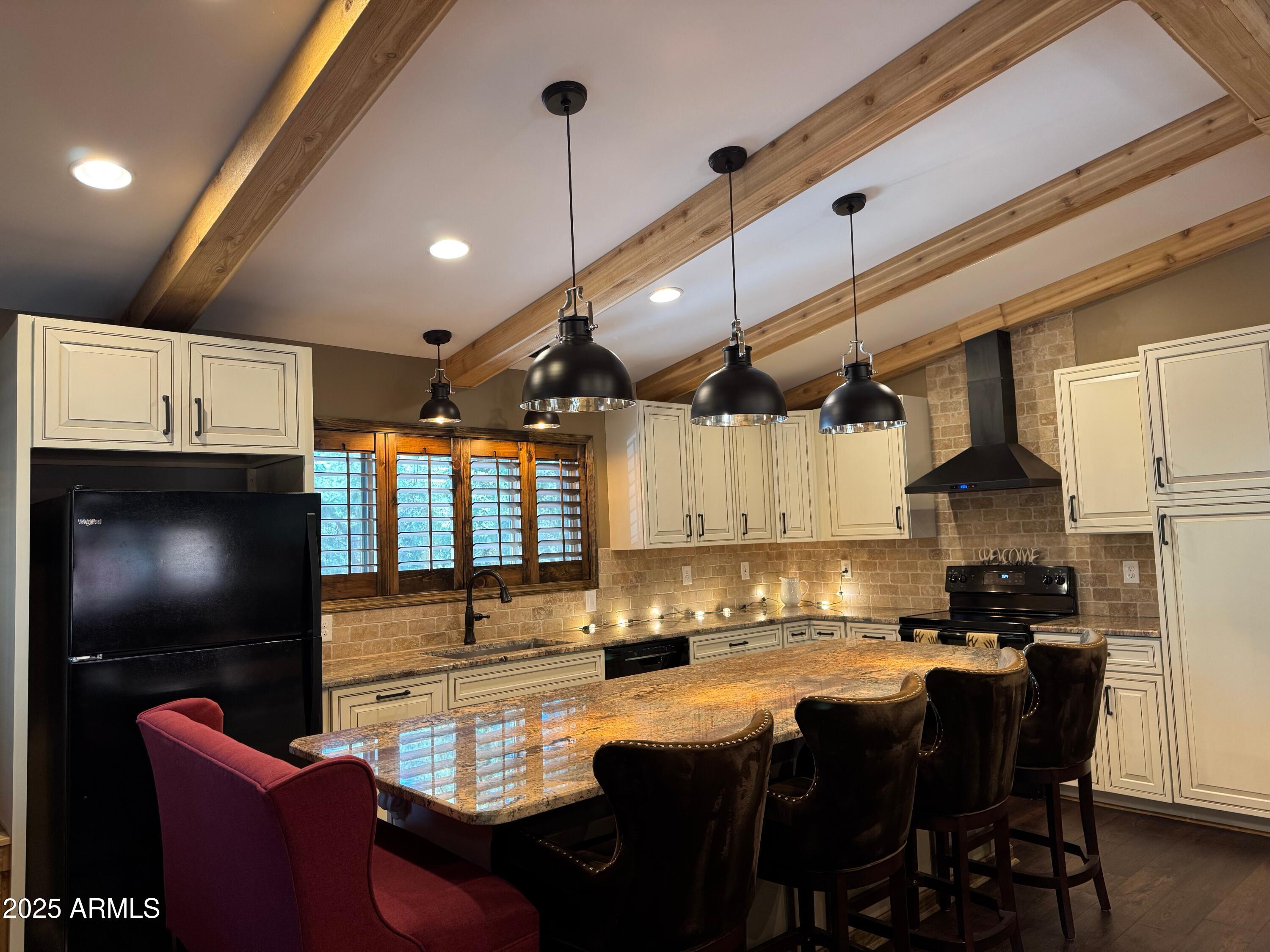 3998 Bloody Basin Road Pine, AZ 85544 - Photo 71 of 71 a kitchen with stainless steel appliances granite countertop a sink a stove and a refrigerator