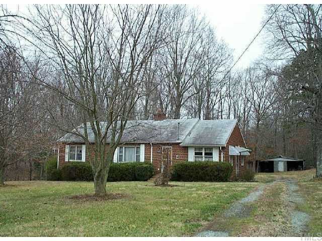10656 Durham Road Timberlake, NC 27583 - Photo 1 of 1 a front view of a house with a yard