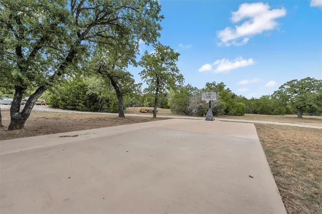 a view of a road with a yard