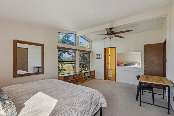 a bedroom with a bed and window
