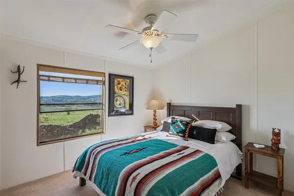 a room with window and wall paintings