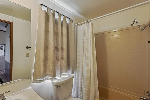 a bedroom with two beds and painted walls