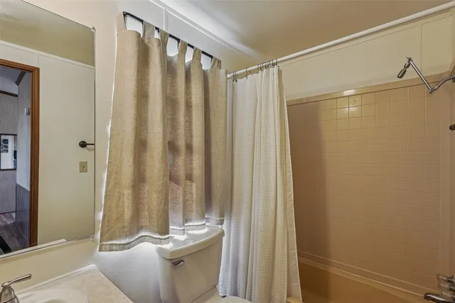 a bedroom with two beds and painted walls