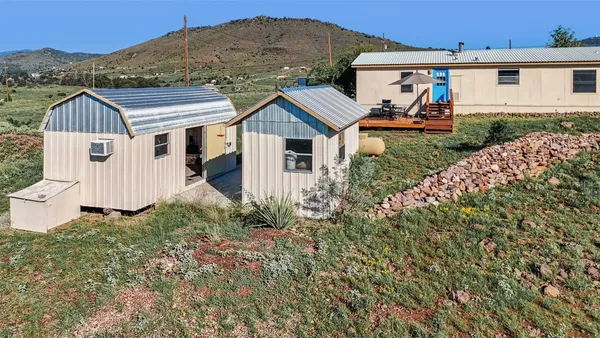 a view of a porch with furniture and floor to ceiling window