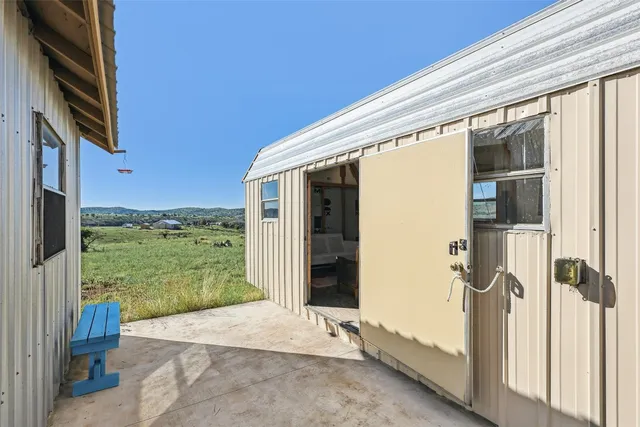 a view of an chairs and table in the balcony