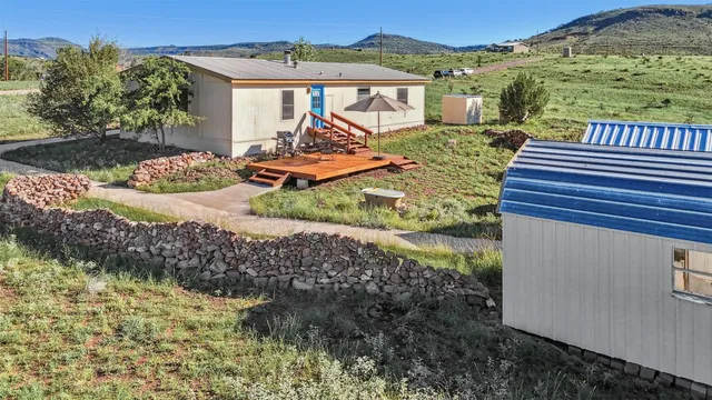 a view of a field with an ocean