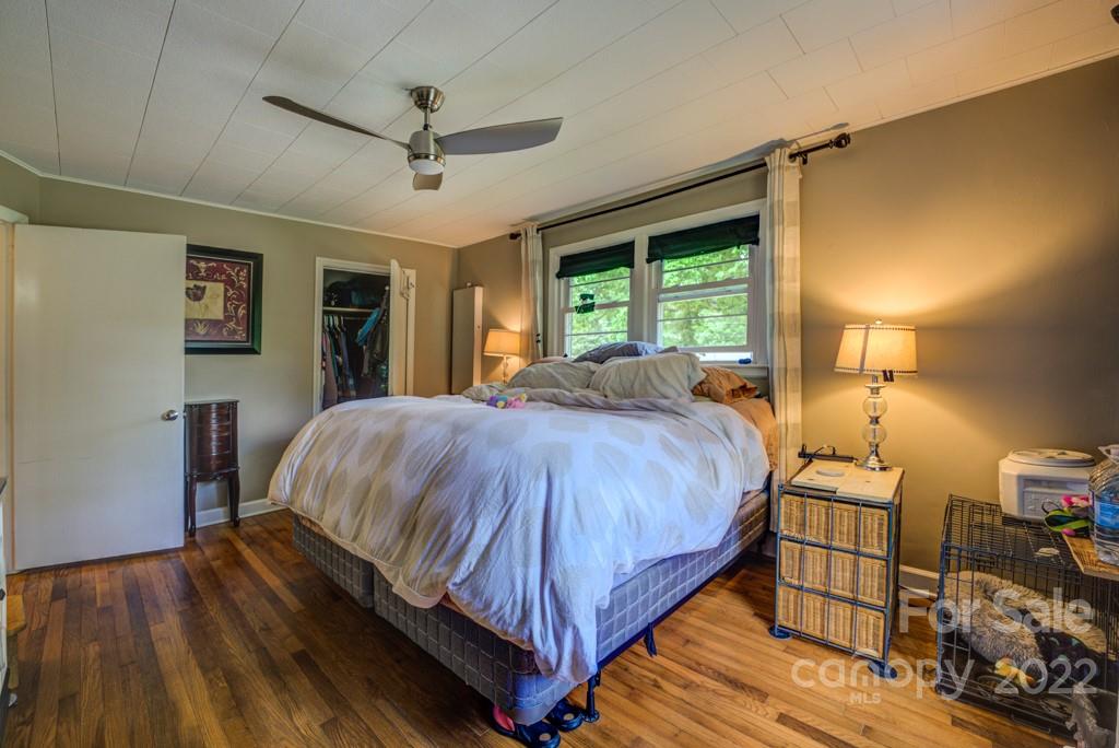 292 Brookside Camp Road Hendersonville, NC 28792 - Photo 11 of 41 a bed sitting in a spacious bedroom next to a window