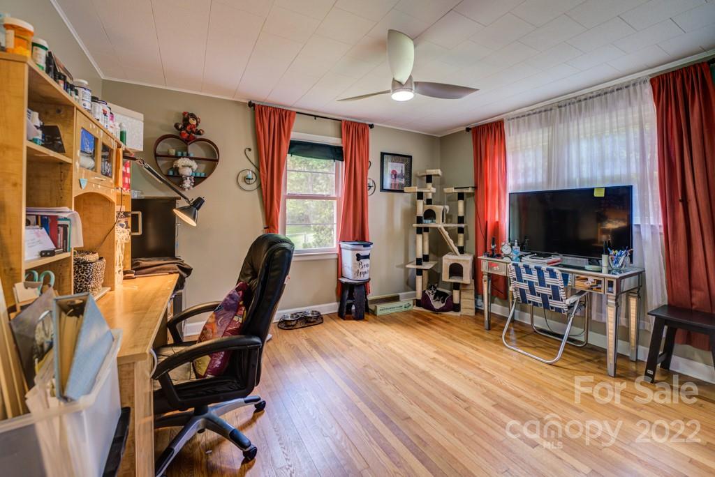 292 Brookside Camp Road Hendersonville, NC 28792 - Photo 14 of 41 a living room with furniture and a flat screen tv