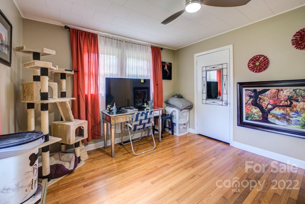 292 Brookside Camp Road Hendersonville, NC 28792 - Photo 15 of 41 a view of a livingroom with furniture and a flat screen tv