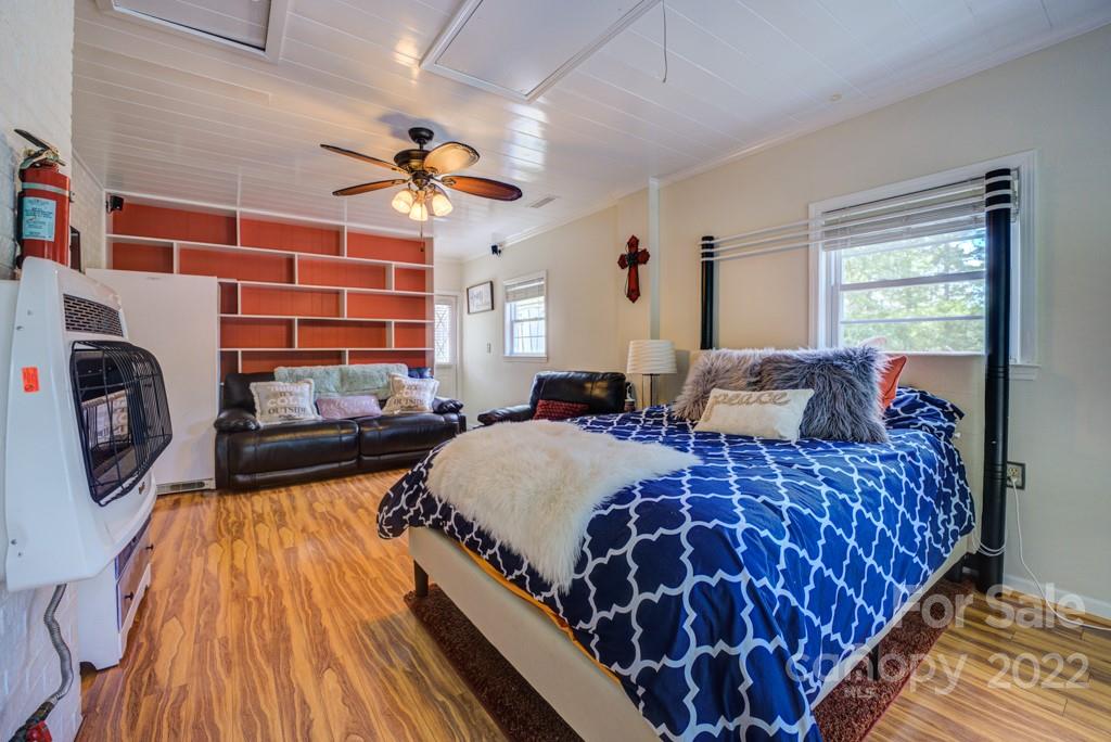 292 Brookside Camp Road Hendersonville, NC 28792 - Photo 19 of 41 a bedroom with a bed and window