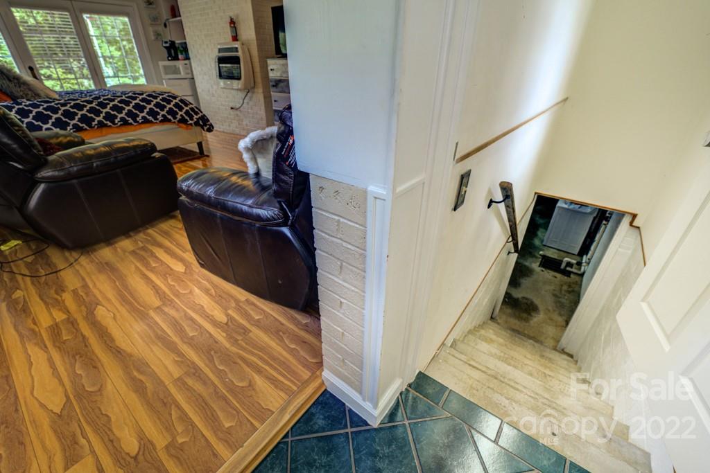 292 Brookside Camp Road Hendersonville, NC 28792 - Photo 20 of 41 a bedroom with a bed and a window