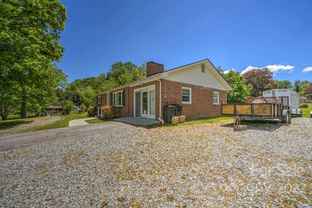 292 Brookside Camp Road Hendersonville, NC 28792 - Photo 26 of 41 a front view of a house with a yard