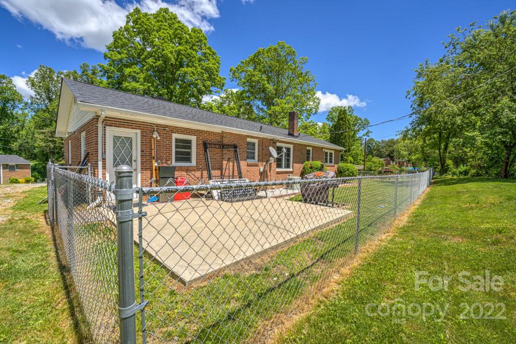 292 Brookside Camp Road Hendersonville, NC 28792 - Photo 29 of 41 a view of a house with pool and chairs