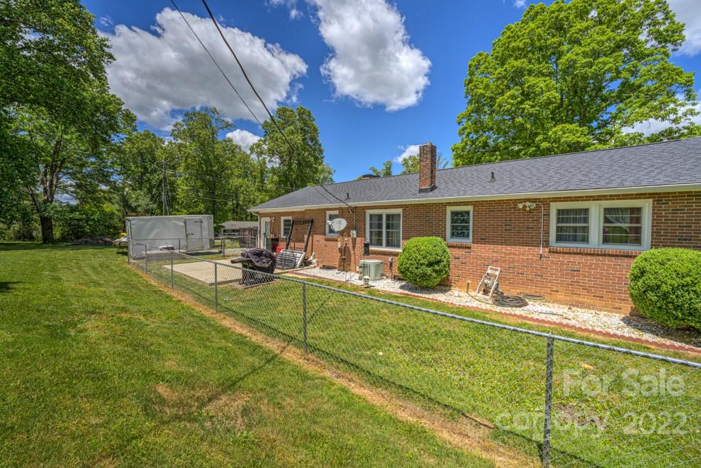 292 Brookside Camp Road Hendersonville, NC 28792 - Photo 30 of 41 a view of house with a swimming pool