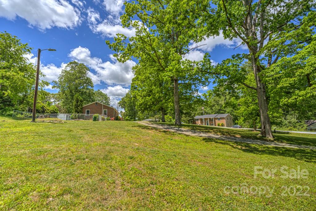 292 Brookside Camp Road Hendersonville, NC 28792 - Photo 37 of 41 a house view with swimming pool