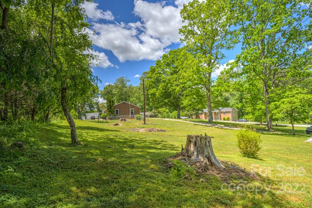 292 Brookside Camp Road Hendersonville, NC 28792 - Photo 38 of 41 a swimming pool with an outdoor space and seating area