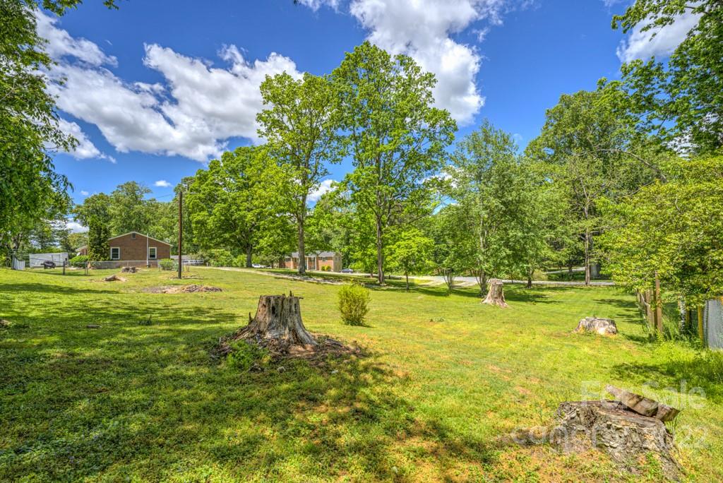 292 Brookside Camp Road Hendersonville, NC 28792 - Photo 39 of 41 a view of a swimming pool with an outdoor space and seating area