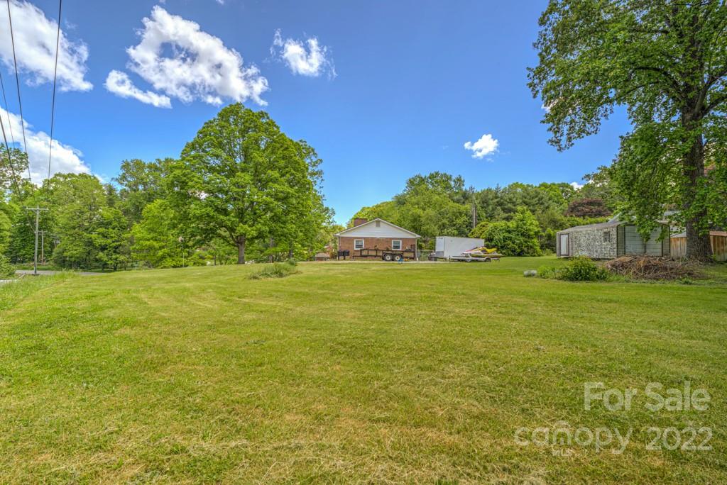 292 Brookside Camp Road Hendersonville, NC 28792 - Photo 40 of 41 a view of a house with a yard