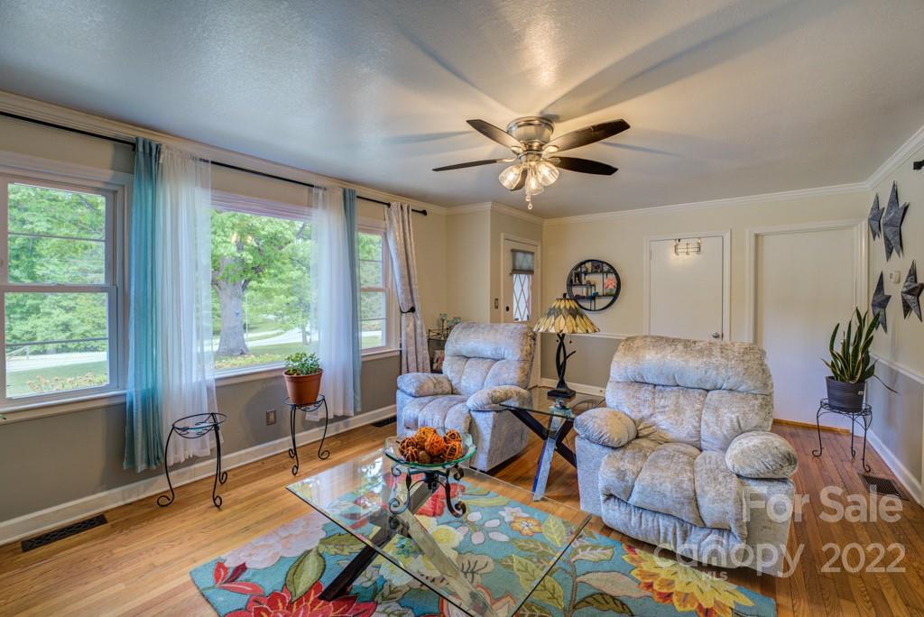 292 Brookside Camp Road Hendersonville, NC 28792 - Photo 4 of 41 a living room with furniture and a large window